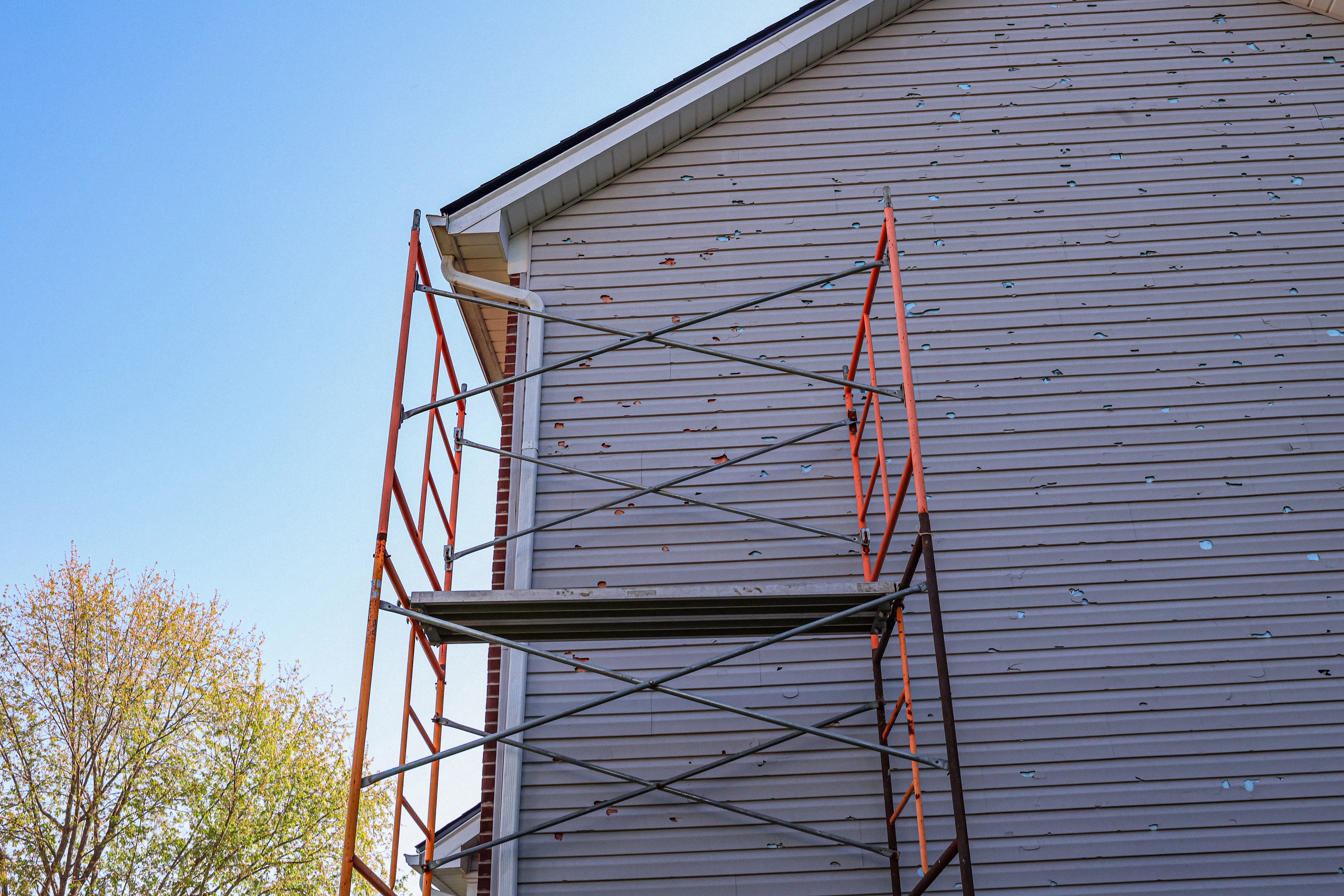 Asphalt shingle roof showing signs of storm damage